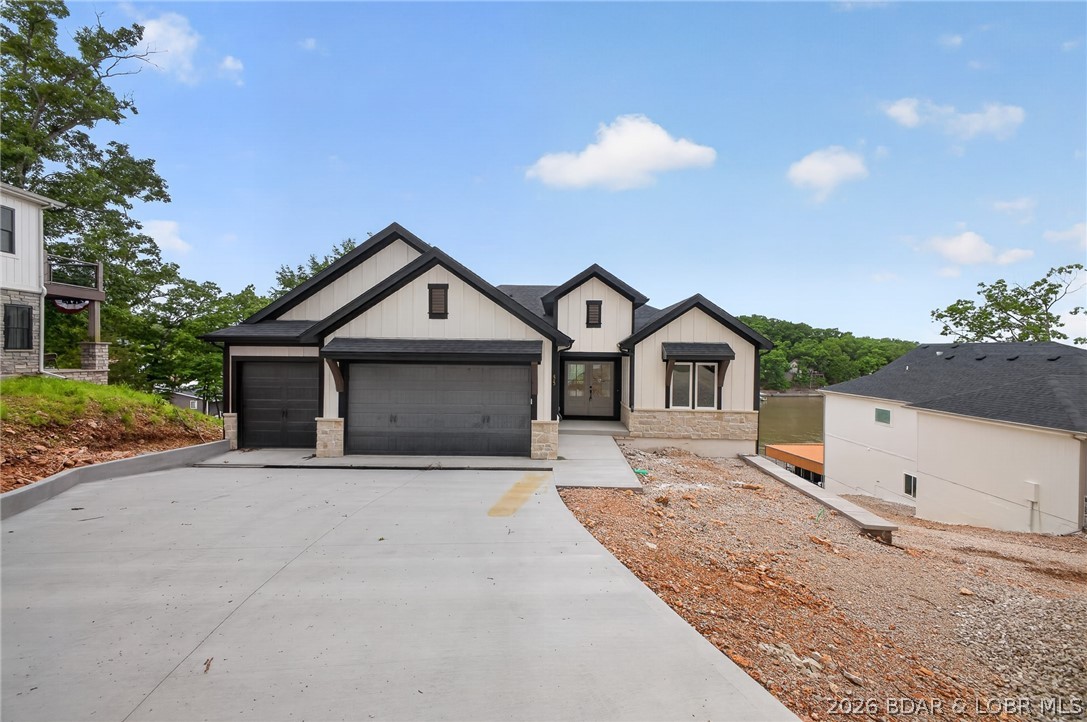 Welcome to your brand new waterfront home located here at Lake of the Ozarks!! This stunning new construction property features 4 beds & 4 full baths, perfect for entertaining, relaxation & unwinding. The home is designed as a two story walkout, allowing you to take full advantage of breathtaking views of the water. Located in a cove with main channel views, this home is perfect for the ultimate lakefront experience. The interior features main level living. With a master suite, kitchen, living, dining, laundry & guest bedroom. Walkout to the upper level deck & enjoy those VIEW! The lower level features 2 bedrooms, two full baths & a second living entertaining space. The lower level patio has a gentle walk down to the dock where you will find deep water & stunning views of Lake of the Ozarks. Seller is offering a 50,000$ dock allowance and a furnishings package will be in first week of June to complete the package. Lake side retaining walls to be finished around first week in June. Schedule private showing today!!