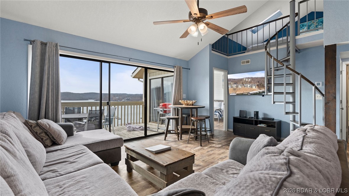 Motivated Seller!! Experience elevated lake living in this top-floor condo showcasing sweeping views of the beautiful Lake of the Ozark's that simply can't be replicated. This unit offers 2 bedrooms, 2 full baths and a versatile loft, ideal for hosting guests or maximizing rental occupancy. From sunrise to sunset, enjoy the panoramic lake scenery and the vibrant energy of the water below. The condo includes a 10X24 boat slip and perfectly positioned near Margaritaville, owners and guests alike will appreciate the close proximity to premier dining, entertainment and attractions. Whether you're searching for a refined personal retreat or a TURN-KEY income producing investment, this condo delivers location and long-term value in one remarkable package!!