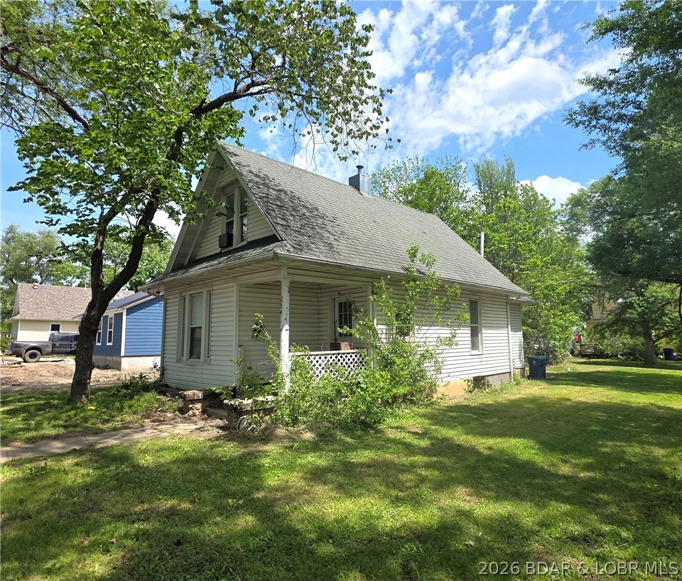 This cute little house is just waiting to be brought back to life! It has three bedrooms (one down/two upstairs) and one bath with a large living and dining room. A 2-car detached garage/carport is in the back. Plenty of parking space. It sits on a corner lot with beautiful shade trees and a flat grassy yard. Also, located close to the conveniences of the downtown area and middle/high schools (including Casey's gas and a Dollar General mere blocks away). It has both electric, and natural gas hook-ups. The property next door was just fully remodeled. This home will need significant work and is being sold as-is. Rent to own is not being offered.