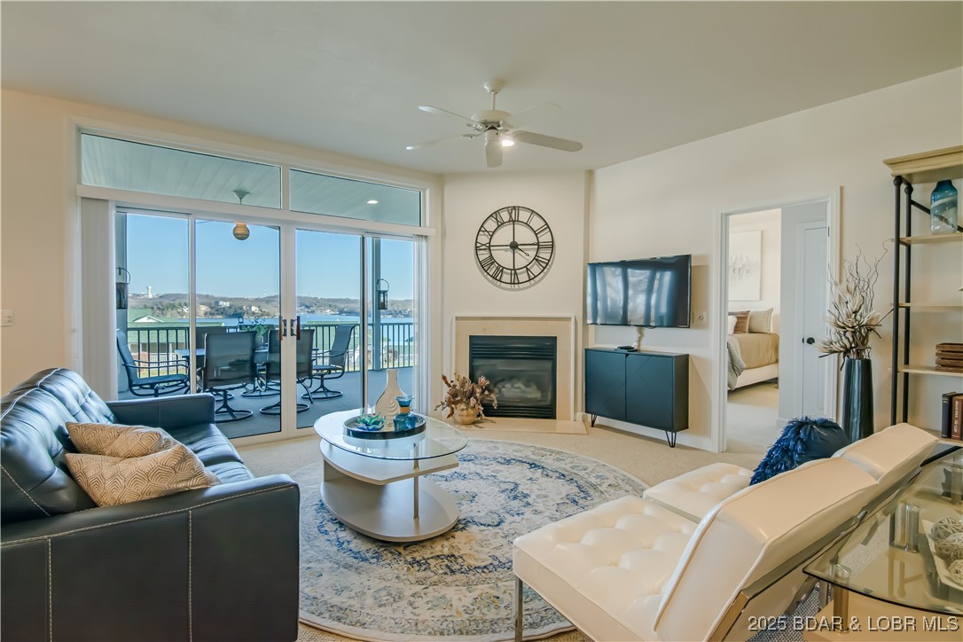 Welcome to this beautifully updated 3 bed, 3 bath condo in The Evergreens at the Lake, perfectly situated at the 18 MM of the Lake of the Ozarks. This ground-floor unit offers minimal steps, making it ideal for all ages and lifestyles. The condo is truly turn-key—everything you see stays, including stylish décor and furniture—so you can start enjoying lake life immediately.
Modern updates shine throughout with stainless steel appliances and recent upgrades to the HVAC, water softener, and water heater. The building’s roof was replaced last year, adding peace of mind for years to come.
Step out onto the massive screened-in back deck, perfect for entertaining or relaxing. From here, enjoy views of the pool and playground, allowing kids to play while you watch comfortably from home.
This condo includes a 12x28 boat slip with a 10,000 lb hoist—just bring your boat and hit the water. Even better, this listing offers a rare bonus no others in the complex have: a garage located just down the hill from the condo. Close to everything by land and water, this is lake living at its best.