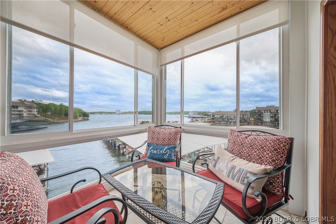 Updated, Top-floor, corner unit nestled in a cove with stunning main channel views. This 3BR/3BA condo offers over 2,300 sq ft. making it perfect for full-time living or weekend escape. Vaulted ceilings create airy, open feel, while thoughtfully designed floor plan allows each space to flow seamlessly without ever feeling confined. Each bedroom features its own en-suite, offering comfort & privacy for family guests alike. Two enclosed decks extend your living space right to the water's edge-ideal for relaxing, entertaining, or simply soaking in the lake lifestyle. The updated kitchen has a double island ready for all your entertaining.  Looking to unwind & connect to the water, this unit delivers. Located at The Charleston at the 12MM, you'll enjoy easy access by both land & water, whether you are heading out for a day on the lake or a quick trip to nearby restaurants & shops, everything is just minutes away. Just steps from parking to your top-floor unit, plus your boat slip & PWC slips are right in front of your condo. This unit truly has it all from beautiful views to boat slip, garage, & remodeled tastefully. 261-3B has every detail dialed in & the lake is yours to enjoy!