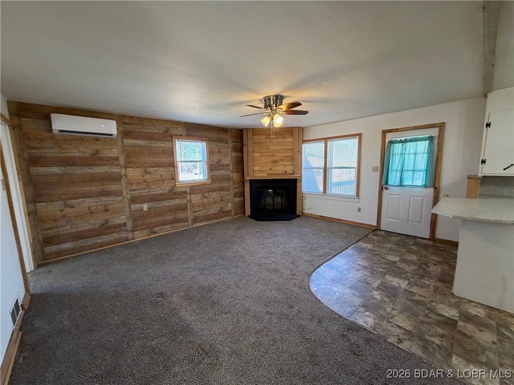 Cute as a button! This cozy cabin is perfectly positioned on a generous corner lot, offering extra space & charm. Early morning coffee on the adorable covered front porch &  host gatherings on the spacious entertaining deck, all set within the quaint and charming subdivision of Paradise Point Beach. Many updates include-new roof (9/25), mini split (23), new 36x24 Carport (24), new water heater (23) & retaining wall. The seller previously utilized the laundry room as an additional sleeping space (2nd bdrm), offering flexible use depending on your needs. Just a short distance away, you’ll find lake access, a beach area, & a boat ramp. This home offers a true weekend-getaway feel & is ready for endless summer days & unforgettable nights. With plenty of parking, there’s room to invite family, friends, & guests for easy, fun-filled events. Oversized detached 24x28 shop/garage w/concrete floors offers plenty of room for tinkering, for your vehicles/boat & all your lake essentials. AN IDEAL GETAWAY FOR FISHING ENTHUSIASTS! Full of charm & warmth, this adorable cabin is waiting for its new owners to step in, settle down, & enjoy the simple pleasures of a weekend retreat or fulltime home.