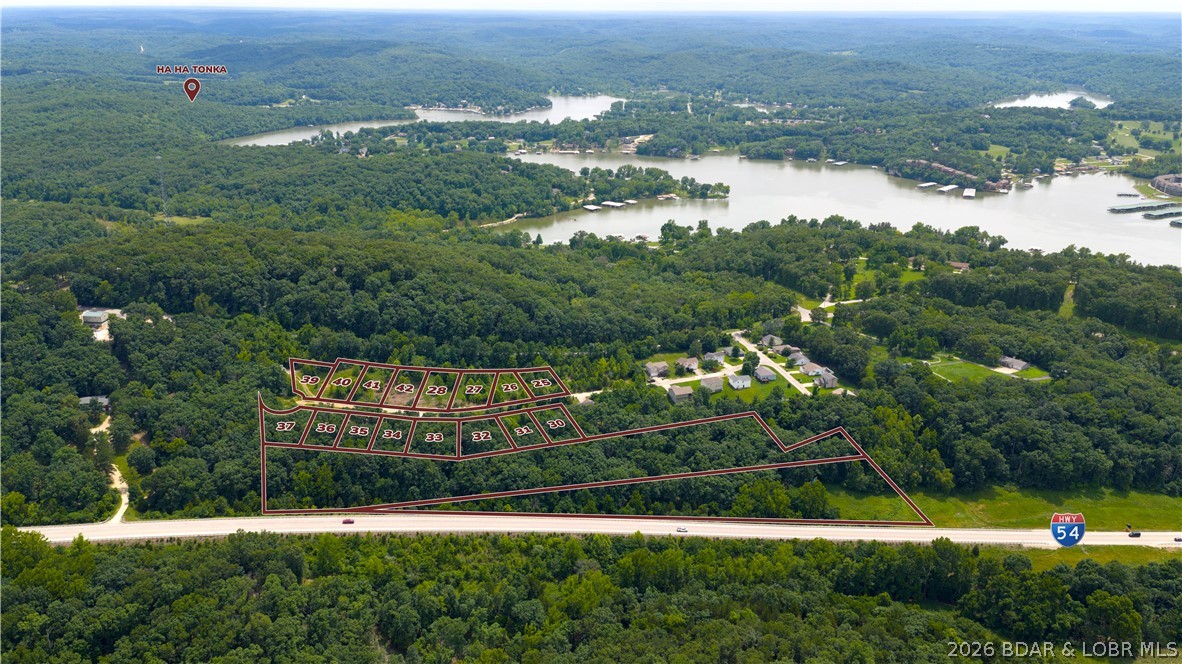 Investors & Developers Take Notice! Opportunities like this don't come along often. This package includes multiple residential lots in the growing Forest Ridge Subdivision just outside Camdenton, offering endless possibilities for its next owner. Community water and central sewer are already in place, and the package includes a newly constructed home at 170 Carol Ann Court along with a neighboring lot that already has the foundation in the ground for the next home, making it easy to continue building right away. As an added bonus, the Highway 54 frontage includes two existing billboards generating approximately $900 per year in gross passive income. Whether you're looking for a private place to call home while developing the remaining lots, building a few homes at a time, or completing the subdivision, this property offers the flexibility to fit your plans. Conveniently located just minutes from Ha Ha Tonka State Park, schools, shopping, dining, and easy Highway 54 access. 6.89 acres +16 lots are included.