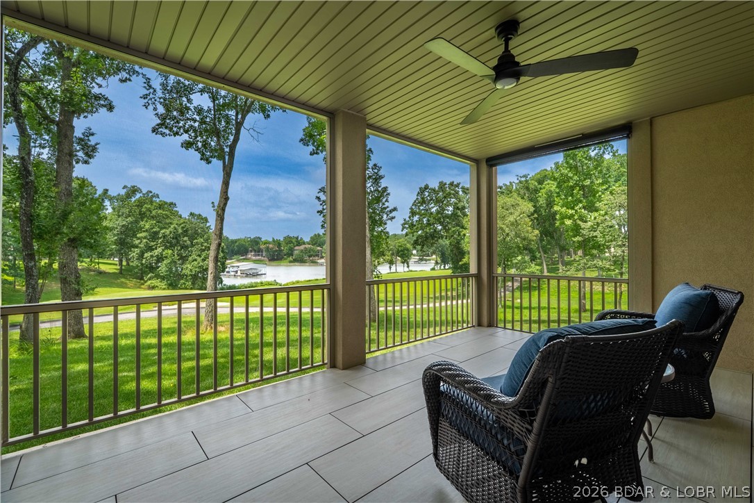 Wake up to panoramic golf course and lake views in one of Porto Cima's most peaceful settings. Perfectly positioned on the 7th green with sweeping fairway views and sparkling views of Evergreen Cove, this beautifully renovated home blends luxury, privacy, and resort-style living. Nestled on a quiet cul-de-sac surrounded by mature trees, the 2022 renovation features luxury vinyl plank flooring, quartz countertops, designer lighting, fresh paint, updated fans and hardware, and custom stone accents throughout. Professionally decorated and meticulously maintained, it's move-in ready. The spacious floor plan offers main level living,  two primary suites, two guest bedrooms, a large non-conforming room ideal for a hobby room, gym, or storage, plus a dedicated office.  Optional membership to the Club at Porto Cima offers championship golf, dining, fitness center, pool, marina, and a vibrant social calendar just a short golf cart ride away. Quarterly dues include lawn care, snow removal, trash service, and exterior pest control. Experience the best of golf, lake, and luxury living in one exceptional home at the Lake of the Ozarks. Video coming soon.