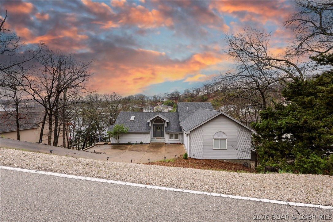 Your ideal lake escape starts here. Step inside and take in the sweeping lake views that make this Four Seasons retreat the perfect second home getaway. With 2,800 sq ft, vaulted ceilings, and an open layout, there’s room to relax, entertain, and host with ease.
Thoughtfully updated, the home features a new roof (2020) and new flooring on the lower level and stairs, along with a 2016 remodel that brought in updated kitchen cabinetry, KitchenAid stainless appliances, under-cabinet lighting, refreshed baths, water heater, and water softener..making this a true move-in ready retreat.The main level offers easy living, highlighted by a spacious primary suite plus a private junior suite for guests. Enjoy evenings by the fireplace or gather around the wet bar after a day on the water. Outside, unwind on the spacious deck or head to your cove-protected dock, ideal for calm water and easy lake days. Recent updates include newer concrete deck piers, Andersen screen doors, and trimmed trees to maximize the view. Bonus: large under-home storage for all your lake toys. Easy, updated, and perfectly positioned...just show up and enjoy the lake. Call today for a private showing!