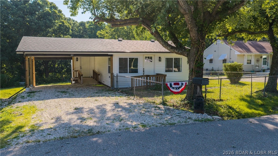Completely remodeled in 2026 and move-in ready, this updated Camdenton home offers modern finishes, a functional layout, and a convenient in-town location. Major exterior improvements include brand-new siding and a new roof, adding fresh curb appeal and long-term peace of mind. Inside, all-new flooring and appliances create a clean, updated feel throughout, while the open floor plan and vaulted living room ceilings make the space feel bright, open, and inviting. An attached carport provides convenient covered parking, and the generously sized backyard offers plenty of room to relax, entertain, or enjoy the outdoors. Located within the city limits of Camdenton, the home is just minutes from shopping, dining, schools, and everyday conveniences. Whether you're looking for a primary residence, weekend home, or investment property, this freshly remodeled home is ready for its next owner. Schedule your showing today!