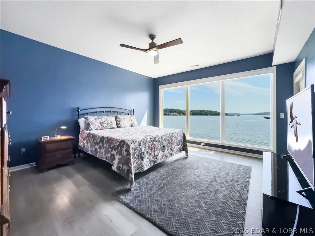Looking for a Condo where you can enjoy a fantastic sunrise view, and shade from the afternoon sun from your living room, screened in porch or your primary bedroom, all in a cove setting with a main channel view? Here it is, a large 3 bedroom, 3 bath furnished unit with a huge screened in porch and a 2 car garage, boat slip with lift and a PWC slip with lift. Located at the 1 mile mark of the Big Niangua. While it is located in the cove, you have an unparalleled view of both the cove and main channel. This is a smaller complex that allows no rentals so you have the utmost privacy and still know your neighbors. Units with this much to offer don't come around often. Come and take a peek at this unit before it gets away. Call for your private showing appointment today.