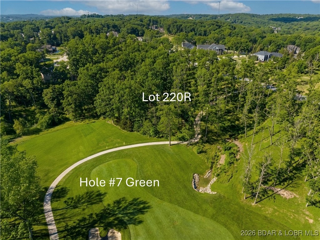 One of the last desirable lots overlooking the renowned Osage National Golf Resort, featuring an incredible 27-hole Arnold Palmer–designed course. Just under one acre, this cul-de-sac lot offers a mostly flat building site with a gentle rear slope and stunning views of Hole #7 on The Mountains Course. Build your dream home with plans already completed and available (see renderings). Ownership provides the exclusive opportunity for membership to this prestigious course, which continues to elevate its reputation with major upgrades: The River renovated in 2024, The Mountains in 2025, and The Links scheduled for 2026. Enjoy top-tier amenities including a zero-entry pool, clubhouse with indoor and outdoor dining, fitness center, pro shop, and playground. Conveniently located just off Highway 54, offering easy access to Lake of the Ozarks dining, shopping, marinas, medical facilities, and top-rated schools. A rare opportunity and truly the last chance to build with a sought after golf course frontage at Osage National.