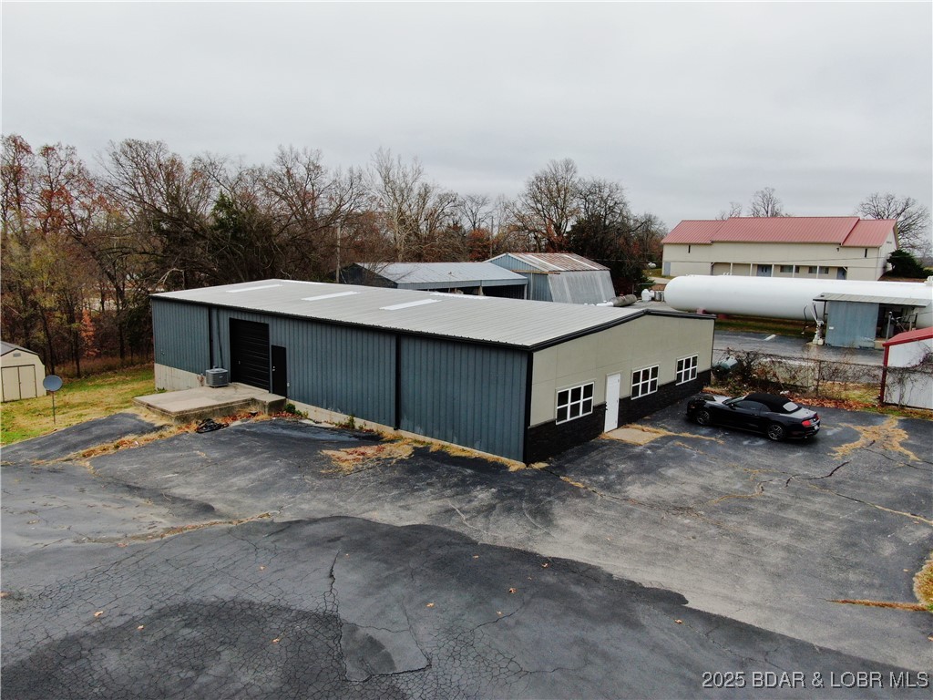 Welcome to 1192 South Business Route 5, a versatile and well-constructed commercial property offering exceptional exposure, practical functionality, and flexible use potential in one of Camdenton’s most active business corridors. Situated on a 0.54-acre parcel just right outside of city limits, this 4,000± sq ft steel-frame building delivers a rare combination of spacious interior work areas, reliable infrastructure, and adaptable layout possibilities suited for a wide range of commercial operations. This property is ideal for businesses seeking a location that provides both visibility and utility—whether you're establishing a new operation, expanding an existing service business, or seeking a solid investment opportunity with future lease potential.