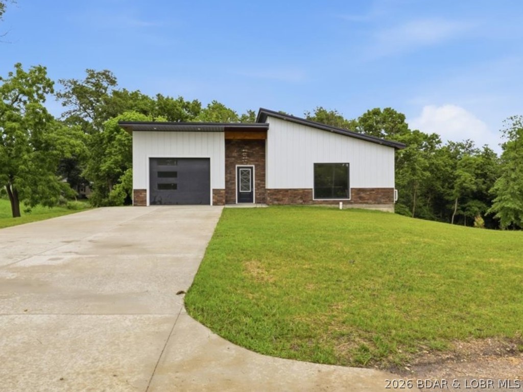 Your dream home awaits in this brand-new, stylish 1,920 sq ft house, perfectly located on a lovely city lot. This ready-to-move-in home has 3 bedrooms and 2.5 bathrooms, showing off its quality and making you feel warm and welcome right away. Every detail of the house has been carefully thought out, from the smartly designed kitchen and peaceful back porch to the walkout lower level living area. It also includes a one-car garage and plenty of storage. Located in the growing town of Versailles, this home puts you in a friendly community, offering both convenience and charm. This home offers the perfect mix of modern luxury, comfort, and community for today’s buyer. Bring your offers today!