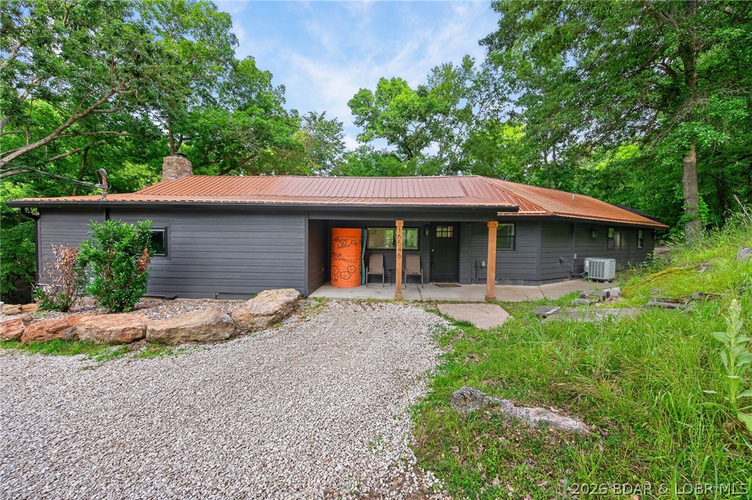 This beautifully renovated property offers the perfect blend of comfort, style, and unbeatable views at the Lake of the Ozarks. The primary home features 2 spacious bedrooms and 2 full bathrooms across 1,963 sq ft, designed with large, open living and entertaining areas that make hosting family and friends effortless. Step outside to a generous deck overlooking the water—ideal for morning coffee, evening sunsets, or weekend gatherings. With direct lakefront access and your own private dock, you’ll enjoy everything lake life has to offer right from your backyard. Situated on 1.63 acres and including two properties, this unique offering also features a fully renovated 400 sq ft guest house (1bed/1bath) and is perfect for visitors, rental income, or a private retreat.  Both homes were completely renovated in 2021.