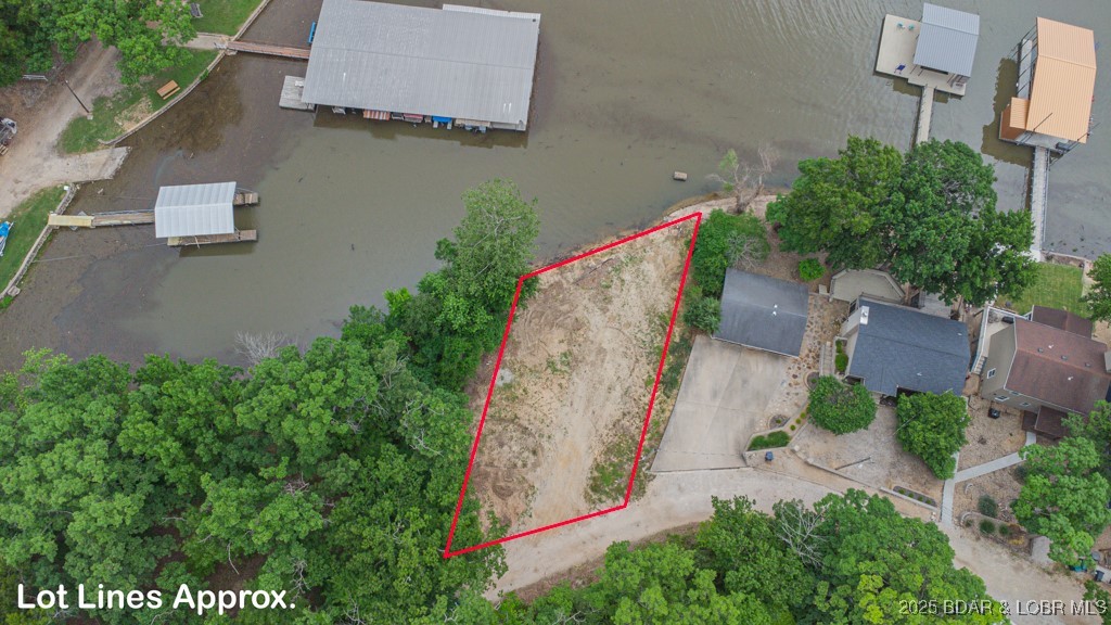 Perfect location right by the four corners on the 29 mm in a deep water cove this exceptional waterfront lot is FLAT and a perfect spot to build your dream home! This prime location offers a HUGE dock envelope (see attached drawings) with the ability to install a 2 well dock with dual PWC spots and a large swim platform. Nestled in a sought-after area, you'll enjoy both privacy and convenience off F Rd - just minutes by car or boat to hotspots like Papa Chubby's, Paradise, Frankie and Louie's and Lake House 13! Don't miss out on this unique opportunity to own a slice of paradise at an affordable price! *SEE ATTACHED FOR APPROVED SEPTIC PLAN AND DOCK DRAWINGS* This one is priced to sell quick, so don't miss out! See additional listing offering lot with spec home.