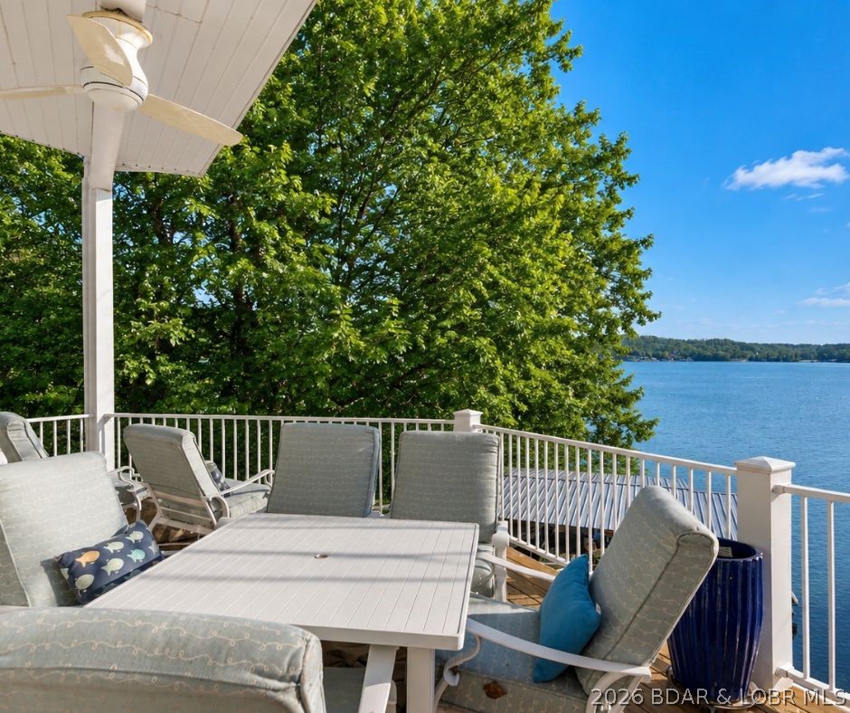 Experience the ultimate Lake of the Ozarks lifestyle in this luxury lakefront retreat, perfectly situated at the 2 MM of the Gravois Arm. 
The home features a primary suite on each floor, creating private accommodations for family and guests alike. Recent 2024 updates add fresh style and functionality throughout. The heart of the home is the beautifully appointed kitchen, complete with a massive island, custom cabinetry, quality appliances, and a built-in ice maker—ideal for hosting after a day on the water. A charming bar area tucked beside the stairway adds even more space to gather and unwind. Main-level bedrooms, both offering private balcony access. The lower level is made for relaxation, featuring a cozy gas fireplace and walkout access to a spacious lakeside deck. Outside, soak in the hot tub while taking in spectacular sunsets and tranquil lake views. Large covered dock with two boat slips and two PWC lifts. Conveniently located just down O Road and minutes from some of the Lake's most popular waterfront restaurants, bars, and entertainment destinations, this exceptional property combines luxury, recreation, and convenience in one unforgettable package.
