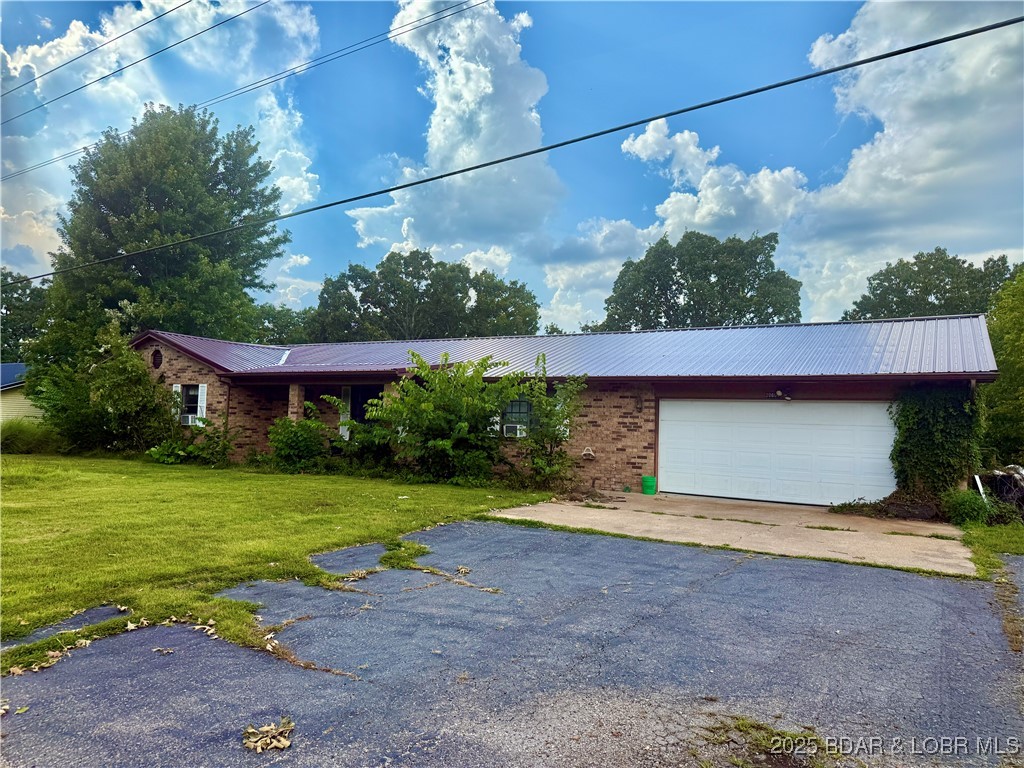 Discover the perfect blend of comfort, convenience, and potential with this charming ranch style home sitting on a FULL ACRE! Step inside to an OPEN FLOOR PLAN that creates a welcoming flow from the living room to the kitchen and dining area—ideal for everyday living and entertaining. Fire up the grill and enjoy evenings on your DECK while overlooking your front and back yard. The spacious 2-CAR GARAGE provides plenty of room for vehicles, storage, or hobbies, while the layout of this home offers flexibility to fit your lifestyle. Located just 10 MINUTES from WALMART in St. Robert and all the restaurants and amenities you could need, this property combines peaceful surroundings with convenient access to town. With its ample space, wooded charm, and thoughtful design, this home holds TREMENDOUS POTENTIAL for anyone looking to create their own vision. Don’t miss this opportunity to own a slice of comfort close to it all—schedule your showing today!