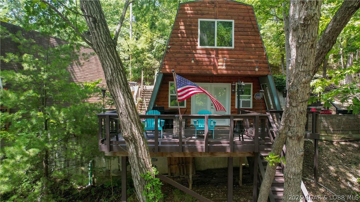 Get ready to entertain and make memories...this beautifully updated lakefront retreat sits on 1.33 acres with an impressive 226 feet of shoreline wrapping around the cove—offering unmatched privacy and a park-like setting. Designed for outdoor living, enjoy multiple entertaining spaces including a spacious deck, patio, and martini deck—all with stunning lake views—plus cozy firepit areas perfect for evenings by the water and even a zipline! This home is completely turn-key with recent updates throughout, making it ideal as a vacation getaway and is already a short-term rental with proven rental income. Plenty of parking and room to expand, add cabins or camping areas or even build another home adds even more potential. The dock features a 10x28 slip with a low water lift for easy docking, along with two PWC drive-on lifts. Conveniently located by land and water at the 5mm of the Osage Arm, you’re just minutes from popular waterfront restaurants, entertainment, and gas docks. This property truly has it all—privacy, views, and lifestyle. Schedule your showing today.