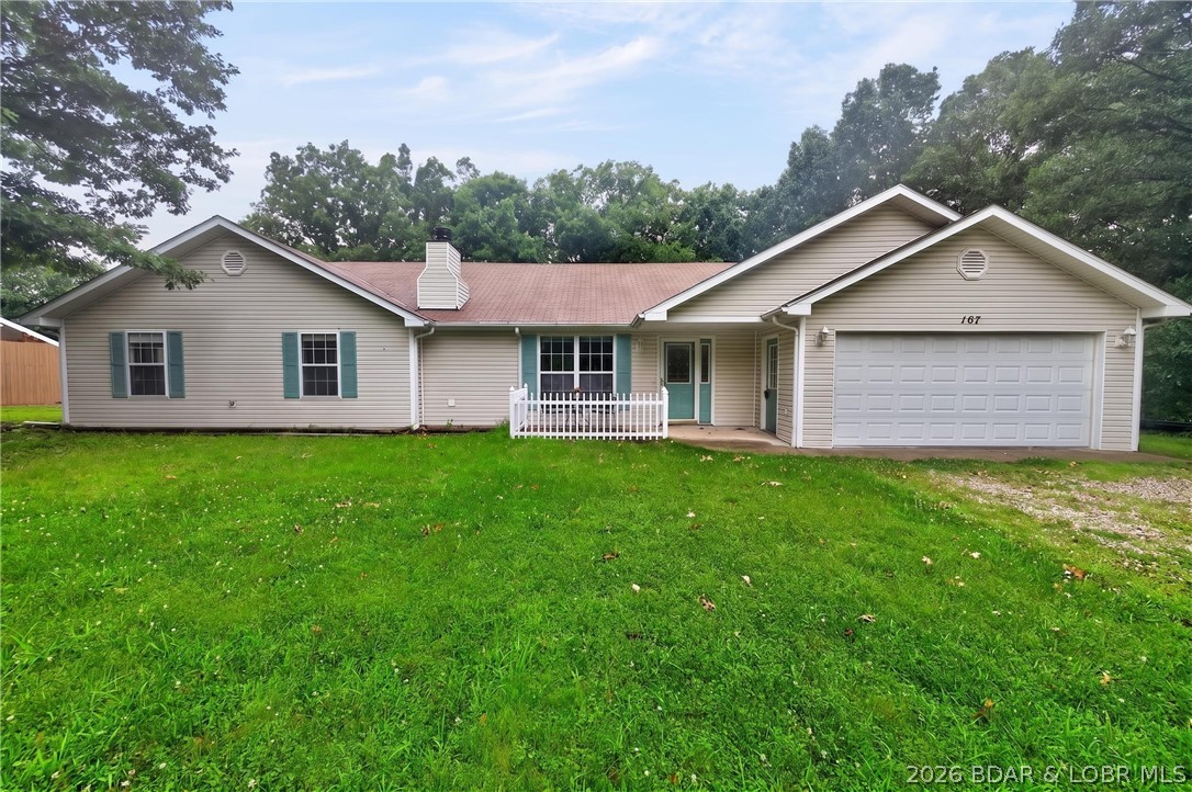 Escape to Lake of the Ozarks in this peaceful country setting. Located on a beautiful, flat, double lot with over an acre of land. The home features 4 bedrooms, 2 full bath, ranch style and a fenced in back yard. Surrounded by mature trees and a quiet setting, you'll enjoy the feeling of being tucked away while just minutes from all the fun the Lake has to offer. Stepping inside you're welcomed with vaulted ceilings, natural light, stone fireplace and an open kitchen. The primary bedroom suite offers a walk in closet, spacious bathroom and tucked away on the far side of the home. The three additional bedrooms are ample in size, perfect for a growing family, guests, home office, gym or as far as your imagination provides. Stepping outside to the fenced backyard the options are endless: growing garden, kids or pets roam, gather around a fire pit or simply enjoy the peaceful countryside setting. To complete this package a 10x28 boat slip is included to spend days on the water at the 26 Mile Marker here at Lake of the Ozarks. If you've been dreaming of a place where you can enjoy quiet country surroundings with Lake access, this is the One.