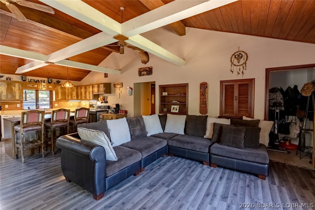 Escape to your own private retreat at 27405 Twin Ridge Rd in Gravois Mills! Nestled on 18 peaceful acres, this charming 3 bed, 2 bath home offers privacy, abundant wildlife, and a true country lifestyle—just minutes from town. The main living room features beautiful shiplap ceilings with open beams, creating a warm and rustic feel. Step outside to enjoy a large deck overlooking your land, perfect for relaxing or entertaining. The walk-out basement includes a lower-level garage for added convenience. Bring your homesteading dreams to life with a fenced garden, chicken coops, and an additional outbuilding. A bonus structure on the property—currently used as an office—could easily become a garden shed, guest space, or small apartment. This is the ideal setting for those craving space, nature, and a little bit of everything. Don't miss this unique opportunity!