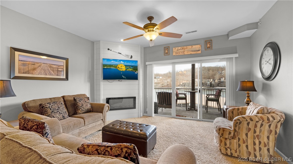 This is the total package! This beautiful 2-bedroom, 2-bath condo features new HVAC, updated kitchen cabinets, tile flooring, stylish tile backsplash, attractive countertops, & newer appliances. A stack washer and dryer are included for added convenience. The inviting living room offers a cozy corner fireplace, while the spacious primary suite boasts a walk-in closet, dual vanities, and direct deck access. Neutral décor throughout makes this unit 100% move-in ready. Enjoy Lake Life to the fullest with a 10x24 boat slip with lift, plus 2 PWC spaces with lifts. This unit comes turn key and is ready for you to move right in. After a day on the water, unwind on the patio and fire up the grill for an easy evening of outdoor relaxation. Loch Haven is a smaller, well-maintained complex with an elevator (no hauling luggage up stairs!) and a pool located in a large, deep cove at the 31 MM. The location is unbeatable—easy access by both land and water, close to popular lake spots like Larry’s on the Lake and Fish & Co., and just minutes from Camdenton for shopping and dining. This unit would be perfect for a weekend getaway, full time, or income producing vacation rental with rental history.
