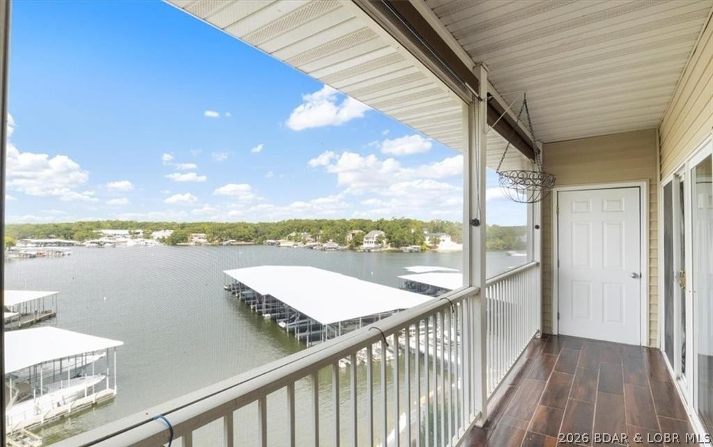 Experience the best of Lake of the Ozarks living in this beautifully updated 3 bedroom, 2 bath lakefront condo in the heart of Osage Beach! This move-in-ready unit offers the perfect blend of comfort, convenience, and recreation with luxury vinyl plank flooring, quartz countertops, and a cozy gas fireplace for year-round enjoyment. The open-concept floor plan is ideal for entertaining and everyday living, flowing seamlessly to the spacious lakefront deck where you can relax and take in the waterfront setting.The primary suite features an en-suite bath, creating a peaceful retreat. Boating enthusiasts will appreciate the included 16x40 boat slip and PWC slip, providing easy access to endless days on the water. Elevator access adds convenience, while the unbeatable location puts you within walking distance of Dog Days and the new Oasis Amusement Park. Shopping, golf, entertainment, and waterfront dining are just minutes away. Whether you're looking for a full-time residence or investment property, this condo delivers. Nightly rentals allowed, making it an excellent opportunity to enjoy the Lake lifestyle while generating rental income. Don't miss this turnkey lakefront retreat!