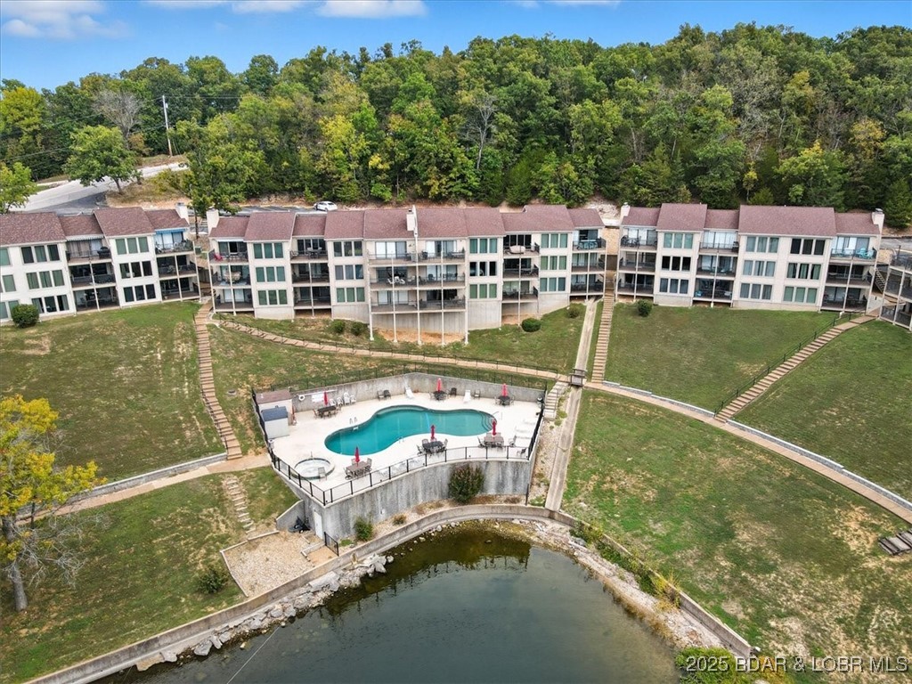 Step into your dream home with this beautifully furnished 2-bedroom, 2-bath condo, where comfort meets elegance. Featuring large windows that flood the space with natural light, you’ll enjoy breathtaking lake views from your private deck – perfect for morning coffee or evening sunsets. Dive into relaxation with not one, but two heated pools and two rejuvenating hot tubs, ideal for soaking after a day on the lake. The beautifully landscaped grounds invite you to stroll and enjoy the natural beauty around you, while the proximity to water activities adds an exciting twist to your lifestyle.  With both a 10 x 20 boat slip and a personal watercraft (PWC) slip included, water enthusiasts will appreciate the convenience of direct access to the lake. Spend your weekends cruising the waters, fishing, or simply soaking up the sun on your boat—your adventures await just steps from your door!  Whether you're looking for a permanent residence, a vacation home, or an investment property, this beautifully furnished condo offers the best of both worlds. Don't miss your chance to own a piece of paradise—schedule your private tour today and experience the magic of lakefront living for yourself!