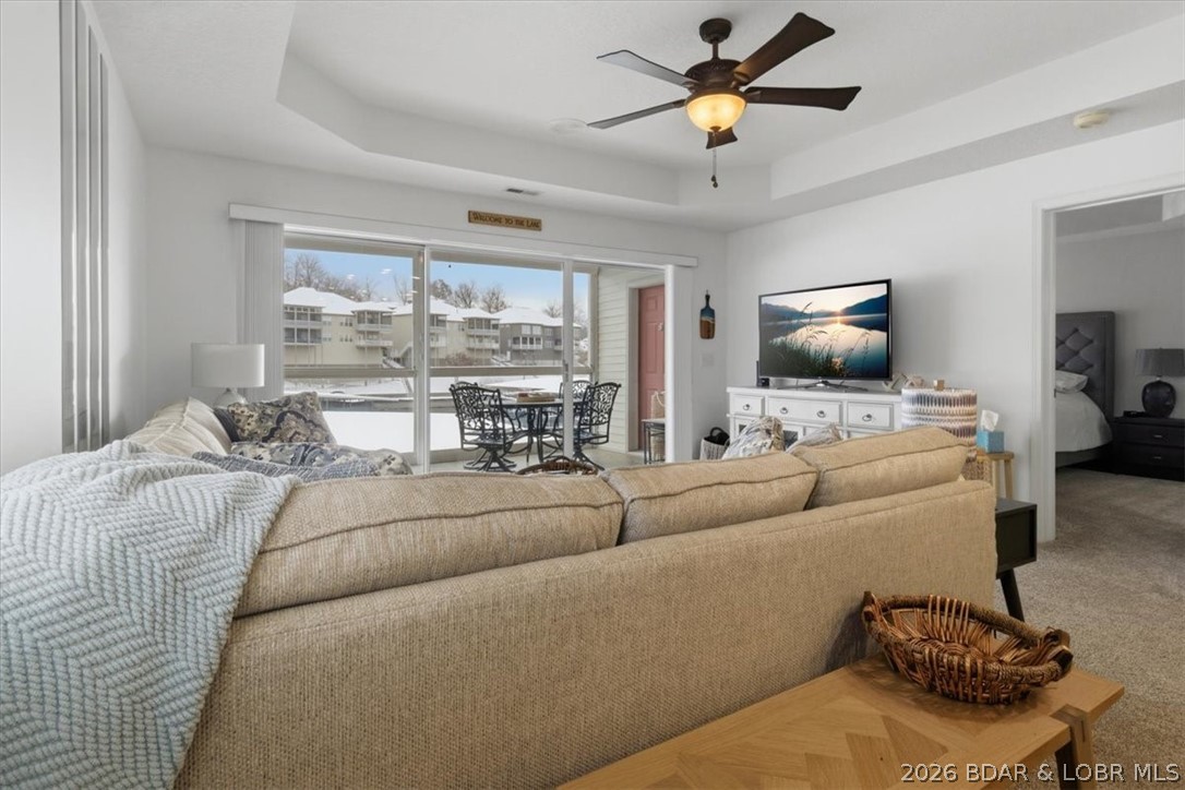 Lakefront living in the beloved Charleston Condominium community is where memories are made & life instantly slows down in the best way. This inviting 3-bed, 3-bath condo wraps you in comfort the moment you walk in, w/a bright, open layout designed for easy living, gathering, & unwinding. Best of all, it’s turn-key—just arrive, exhale, & start living the lake life right away. Step out onto the screened-in deck & soak in peaceful water views where mornings feel softer, coffee tastes better, & sunsets seem to stretch just a little longer. With 1,385 square feet, there’s room to spread out, recharge, & truly settle in after long, sun-filled days on the water. A 10x30 boat slip w/hoist is included just steps away, turning spontaneous lake days into your everyday reality. Plus, enjoy added peace of mind with a 1-year Old Republic Home Protection Gold Plan included with the home. Now offered at a new price, this is an even more exciting opportunity to step into the lake lifestyle you’ve been waiting for. Close to dining, shopping, & golf, yet tucked into a setting that feels like a getaway, this is more than a condo—it’s your lakeside escape. Don’t miss your chance to see it in person!