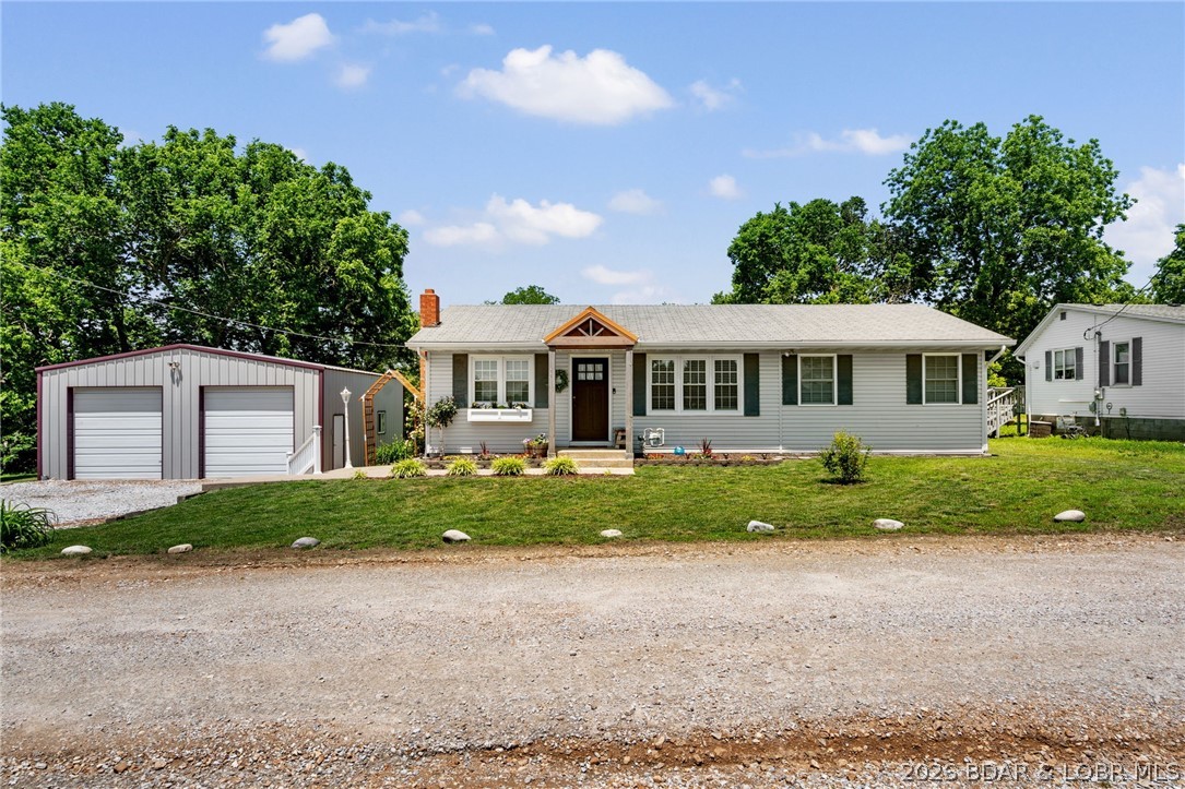 Welcome home to this well-maintained 3-bedroom, 2-bath ranch-style residence offering comfortable living and desirable features throughout. Step inside to find beautiful wood flooring, ceiling fans, and a spacious layout designed for everyday living and entertaining. The kitchen includes a convenient pantry for added storage, while the primary suite and additional bedrooms feature generous walk-in closets. A partial basement provides extra storage space and flexibility for hobbies, a workshop, or future finishing opportunities. Enjoy outdoor living on the open rear deck, perfect for grilling and relaxing, or unwind on the inviting covered front porch. The detached two-car garage offers ample parking and storage. With its attractive ranch design, functional floor plan, and appealing amenities, this home is ready for its next owner to move in and enjoy.
