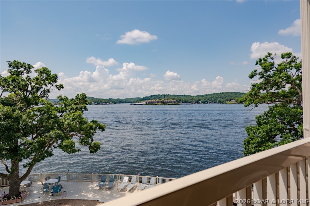 Wake up to breathtaking lake views, spend your afternoons lounging poolside just steps from your door, and end the day with dinner and live entertainment at some of Lake of the Ozarks' most popular waterfront destinations, all just minutes away. Whether you're searching for the perfect weekend escape, a full-time lake home, or an investment property with rental potential, this condo offers an incredible opportunity to experience everything lake life has to offer. Located in one of the most desirable buildings in the complex, this lakefront condo boasts some of the best panoramic views available while offering unmatched convenience with the pool right next door. Inside, the floor plan is ready for your personal style and vision. The interior presents the perfect opportunity to renovate and create the lake retreat you've always wanted, without paying a premium for someone else's design choices. You'll be just minutes from the lake's best restaurants, entertainment, shopping, golf courses, and year-round attractions. Prime location, spectacular views, endless potential, and investment opportunity—this is your chance to make your mark on one of the lake's most sought-after locations.