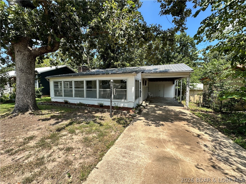 Located at the 86.5MM of the Lake of the Ozarks, this recently remodeled lake cabin is ready for you to decorate and pick out your own appliances with an allowance from the Seller! Featuring New plumbing, electrical, LVP flooring, enclosed sunroom, a new mini-split, and a wood-burning fireplace. A nice sized driveway gives you plenty of room to park your boat. Just a short 2-minute drive to the Community Boat Docks & Ramp, Shelter House with Playground you'll be ready to host family gatherings and head out on water in no time! Full-time living, weekend getaway, Airbnb, lots of possibilities with this home!