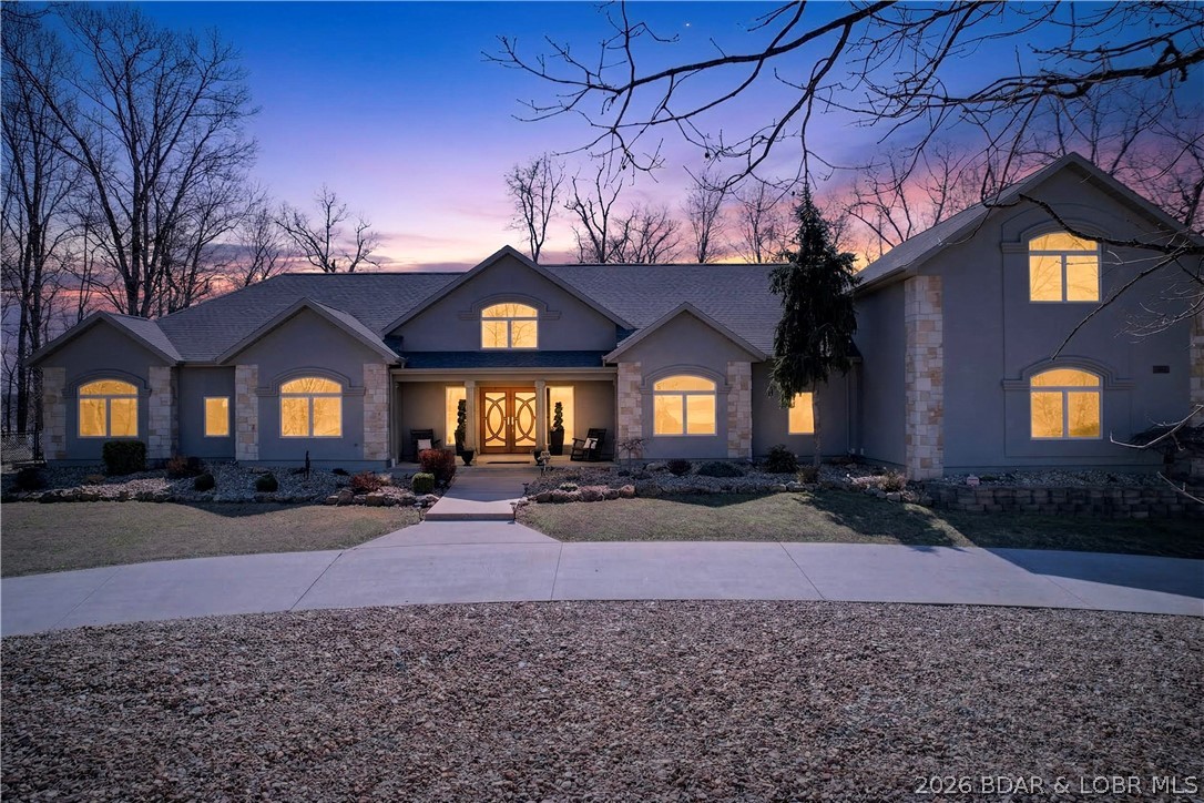 Stunning updated home in highly desired Four Seasons w/ year-round lake views. Welcome to this beautifully updated 4-bedroom, 3.5-bath home (2024–2026 updates) offering timeless elegance, comfort, and year-round lake views. As of 4-6-26 2 slips are available @ Camden On The Lake for lease.  Step through the gorgeous, inviting front doors into an open living space w/ vaulted wood ceilings with exposed beams, two fireplaces, and heated Travertine floors throughout. The expansive kitchen is designed for both entertaining and everyday living, featuring a gas cooktop, double ovens, premium finishes, and generous counter space. The master suite offers a private retreat with walk-in closets, a spa-like bath with air-jetted tub, and a luxurious shower. Also included is a 3-car garage with a finished guest suite above (bedroom & bath), a circle drive, and a fenced backyard ideal for pets or play. Enjoy outdoor living year-round with a screened patio and gazebo, perfect for taking in those beautiful lake views. This home combines thoughtful design, quality updates, and a truly desirable location —a rare opportunity in the HH area. Schedule your showing today, this home won't last long!
