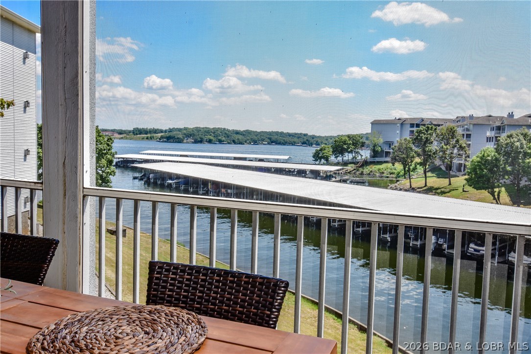 Beautiful condo with very tasteful style and colors! The unit was completely remodeled in 2021. Turn-key 3 bedroom, 3 bath is located on the 12 MM in Regatta Bay, located in a great location for vacation rentals or a family ready to enjoy what the Lake has to offer. Newer furnishings throughout, newer laminate plank flooring throughout, electric stone heat producing fireplace, updated kitchen cabinets with Quartz Countertops, newer stainless steel appliances, custom showers and bathrooms with porcelain tile showers, newer H2O heater and water softener, as well as all blinds. The sunset views from the screened in deck and master bedroom are awesome! Outdoor amenities at Regatta included 2 pools, pickle ball court, tennis court, clubhouse, 2 pavilions, play ground, and breathtaking views. A 12x36 boat slip is included. This location on the 12 MM is hard to beat, with many popular lake restaurants within minutes, and just a short trip to the grocery store, Dam and shopping. Special Assessments that started in 2023 are currently paid through 2026 from the previous owner for this unit.
