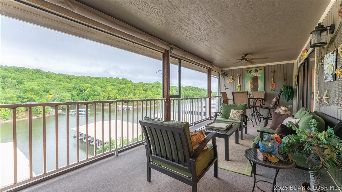Seller is offering a credit toward new flooring & countertops, giving you the opportunity to customize this condo. Located in the desirable Lazy Days complex, this top-floor 2BD/2BA condo overlooks a community pool & is conveniently just 1 flight up from parking. With one of the largest 2-bedroom floor plans in the complex, featuring vaulted ceilings & an open-concept layout that seamlessly connects the kitchen, dining & living areas. A striking stacked-stone fireplace creates a warm & inviting focal point. The spacious screened & covered deck, complete w/an additional storage closet, offers the ideal place to unwind & enjoy the outdoors year-round. Nestled in the scenic Missouri State Park area of Osage Beach, Lazy Days combines peaceful natural surroundings w/easy access to shopping, dining, entertainment, & all the conveniences of Lake life. Community amenities are truly resort-style & include 2 swimming pools, multiple playgrounds, BBQ pavilions, boat ramp, trailer parking, dog park, gaming station, & more. Whether you’re looking for a weekend getaway, full-time residence, or vacation rental investment, this well-maintained condo offers exceptional flexibility & value.