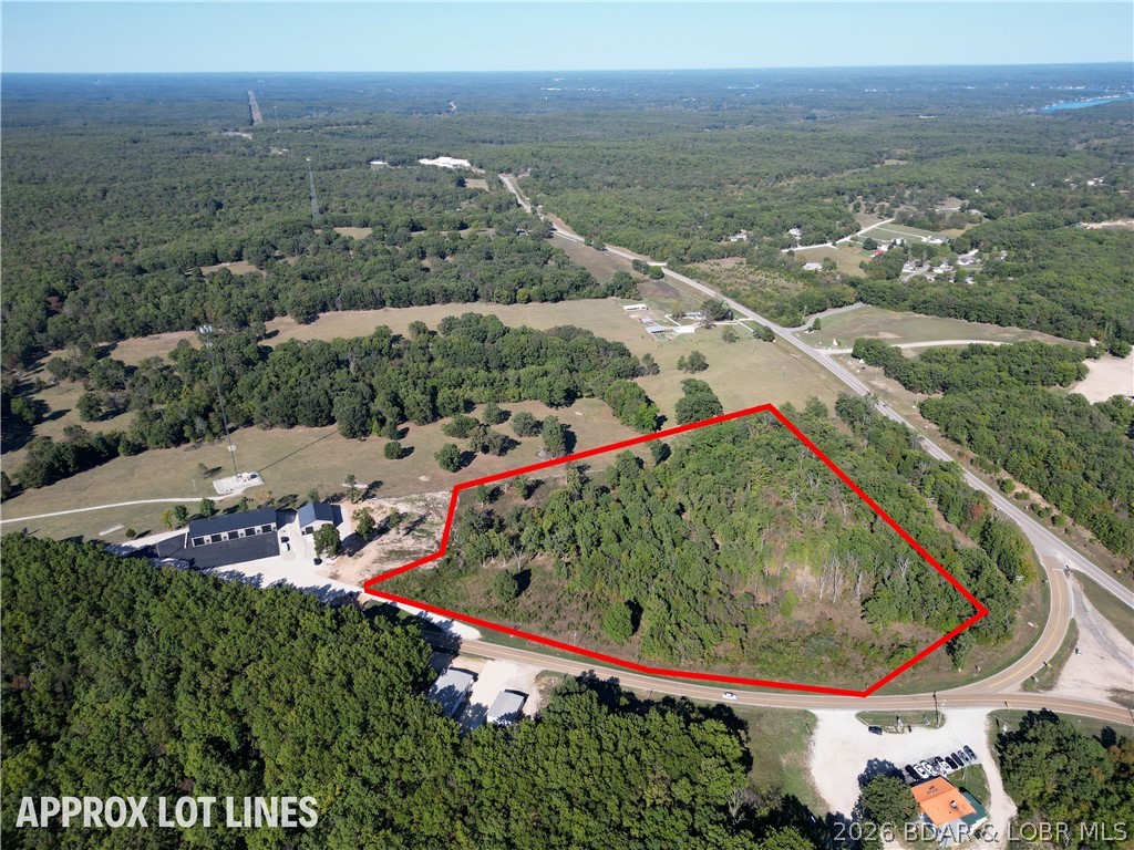 Welcome to your prime real estate opportunity in Laurie, Missouri! This sprawling parcel boasts approximately 10 acres of pristine land, offering a perfect canvas for your residential and commercial ambitions. The previous owner's layout had the Property set up for 8 residential Lots, and five commercial lots located on the Kansas City side of the lake at the intersection of 135 and 5. Whether you're looking to establish retail spaces, offices, or other ventures, these lots provide a strategic location for your business endeavors. Benefit from high visibility and accessibility, attracting both locals and visitors alike to your commercial enterprise. Don't miss out on this incredible opportunity to shape the future of Laurie, Missouri.