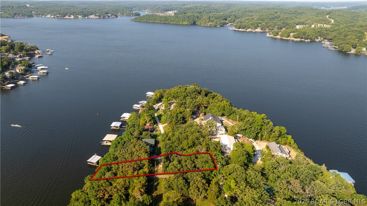 One of a kind property! Boasting 115 feet of Lakefront on the fabulous Sagamo Point, located at the 36 mile marker. If you are looking for privacy with great views, then this property is the ONE! Build your own lake front home with great main channel views, full front deck wrapping around end, and extra second tier lot just across the lane for building your large shop/garage! Good parking. Only minutes from grocery stores, restaurants and shopping.