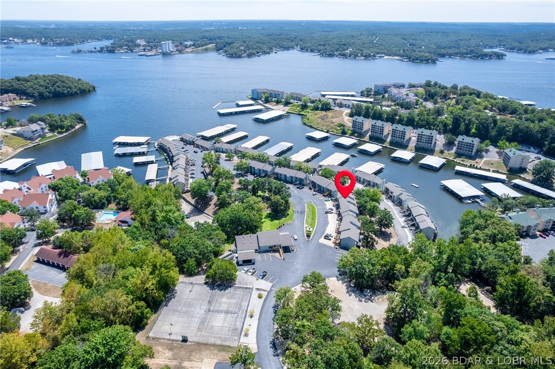 Ready to live the Lake Life? This fully renovated, move-in ready 2-bedroom, 2-bath condo with a 10x24 boat slip & PWC slip, is perfectly located in the desirable Southwood Shores community on Horseshoe Bend. With main-level entry, only one step takes you from the parking lot to your front door. Inside, the entire space has been thoughtfully updated with new LVP flooring, fresh paint, modern lighting, updated plumbing fixtures, stylish vanities with quartz tops, upgraded door hardware, a new hot water heater, and a stackable washer and dryer. The kitchen has been completely refreshed with quartz countertops, stainless steel appliances including a refrigerator, stove, and dishwasher. Furniture is also included, making this condo truly turnkey. Southwood Shores is a gated community at the 12MM of the Osage Arm and offers exceptional amenities including indoor and outdoor pools, a swim dock, tennis courts, playground, and on-site management. With nightly rentals allowed, this property offers both a fantastic investment opportunity and the perfect personal lake getaway. Completely updated and ready to enjoy, this condo stands out from the rest! Jet Ski available for additional money!