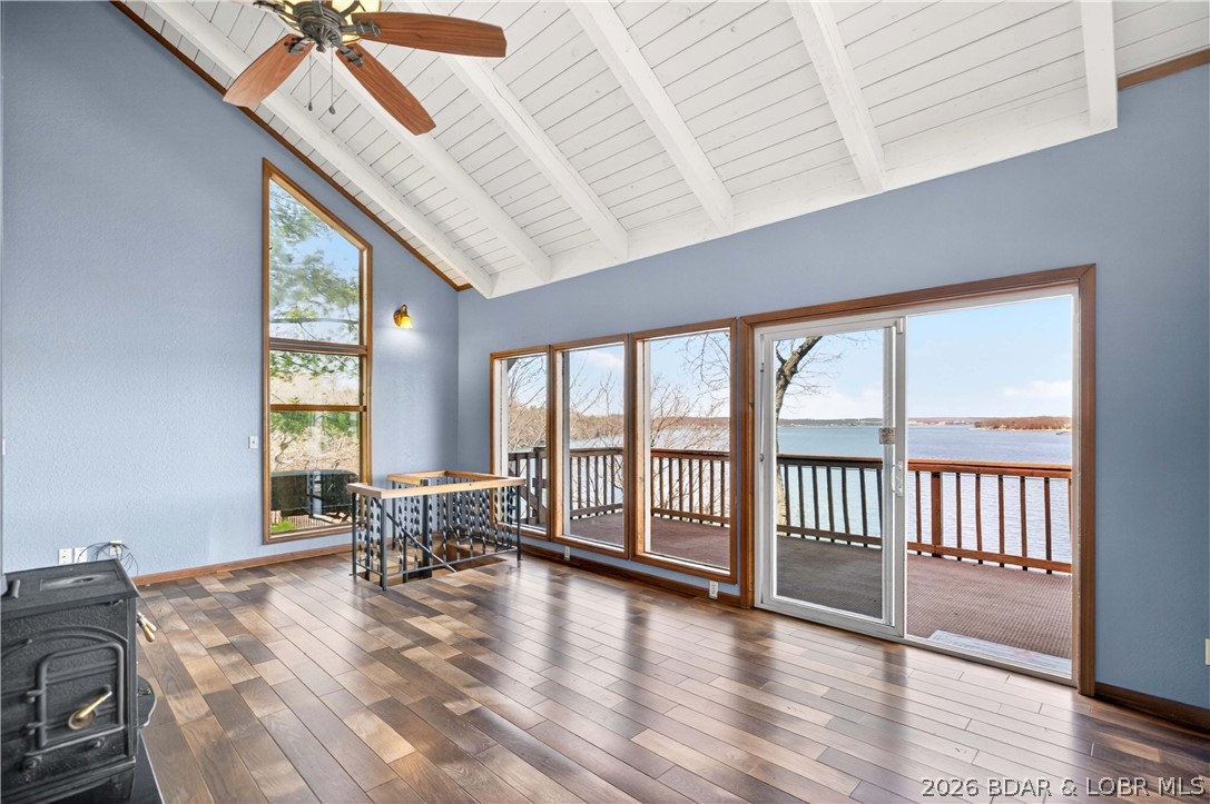 176 Kansas City Way in Sunrise Beach, MO 65079 offers a true Lake of the Ozarks waterfront lifestyle with stunning views and personal lake access. This 3-bed, 3-bath home features +/- 2,056 square feet with a walkout lower level and an inviting layout designed to capture the water from multiple vantage points. Wake up to sunrise views over the lake and enjoy them year-round through large windows that fill the home with natural light. The main living area features a cozy wood-burning stove, while the walk-in level includes a spacious primary suite, additional bedrooms are located on lower levels for guests or family. Outdoor living shines with multiple decks, a hot tub, and a private tram that takes you directly to the shoreline. The property includes a swim dock and is permitted for a larger dock setup. Just minutes from Hwy 5, this home offers convenient access to Sunrise Beach shopping, dining, and lake attractions. With rentals allowed, it also offers excellent potential as a vacation home, investment property, or full-time residence. ***Seller is offering a $500 Achosa Home Warranty with an acceptable offer, adding peace of mind to this exceptional lakefront opportunity.