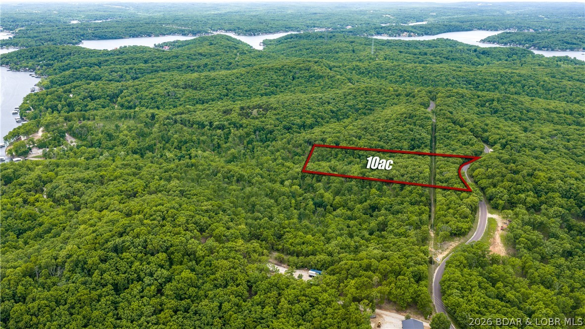 Discover the perfect blend of natural beauty and opportunity with this stunning 10-acre parcel nestled in the heart of the Ozarks. Boasting a gorgeous landscape of mature trees and some of the most level ground you’ll find in the area, this property offers the ideal setting for your dream home, weekend retreat, or future investment. Located directly on blacktop for easy access, it combines everyday convenience with peaceful, serene surroundings. The property will be surveyed prior to closing to determine exact boundaries and acreage. Just 15 minutes from Bagnell Dam and all the shopping, restaurants, and entertainment the Lake area has to offer, this is a rare opportunity to own a breathtaking piece of the Ozarks with endless potential.