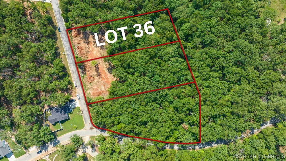 Location is everything, and this is your chance to build a dream home in one of Linn Creek’s most desirable subdivisions. Lot 36, ideally situated at the corner of Matson Road and Chippewa Place, is ready for development with approved plans and completed excavation work. Whether you choose to move forward with the existing plans or explore other options, this lot provides a solid foundation for your vision. With access to sewer and water, plus a smooth, hill-free drive down Y Road, this property offers both convenience and peace of mind. Nestled between Osage Beach and Camdenton—two of the largest communities in the Lake of the Ozarks area—you’ll enjoy the perfect balance of seclusion and accessibility. Additionally, there’s an opportunity to expand by purchasing the two adjacent lots, creating a nearly two-acre parcel at a great price. For more details on all three combined, see MLS #3577489, or check out the individual listings at MLS #3577491 and #3577490. With a prime location and endless possibilities, this property is ready for your next dream project.