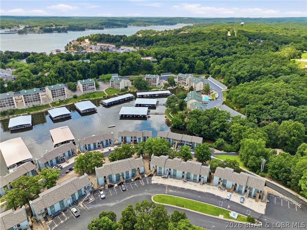 Experience effortless lake living in this turnkey 1-bedroom, 1-bath lakefront condo offering 420 square feet of thoughtfully designed space. Conveniently located just one flight up from parking, this beautifully maintained retreat is offered fully furnished, making it ready for immediate enjoyment or an excellent investment opportunity. Inside, you'll appreciate recent updates including a new dishwasher (2026), new washer and dryer (2025). Whether you're sipping your morning coffee with peaceful water views or unwinding after enjoying all the area has to offer, this condo is designed to make every day feel like a getaway. Southwood Shores offers outstanding resort-style amenities, including a heated indoor pool and hot tub, a lakefront pool with a new sundeck, clubhouse, business center, swim dock, tennis, pickleball and basketball courts, a concrete boat ramp, fish cleaning station, and the security of a gated community. Whether you're searching for a weekend retreat, full-time residence, or income-producing vacation rental, this move-in-ready lakefront condo is a fantastic opportunity. Schedule your private showing today!