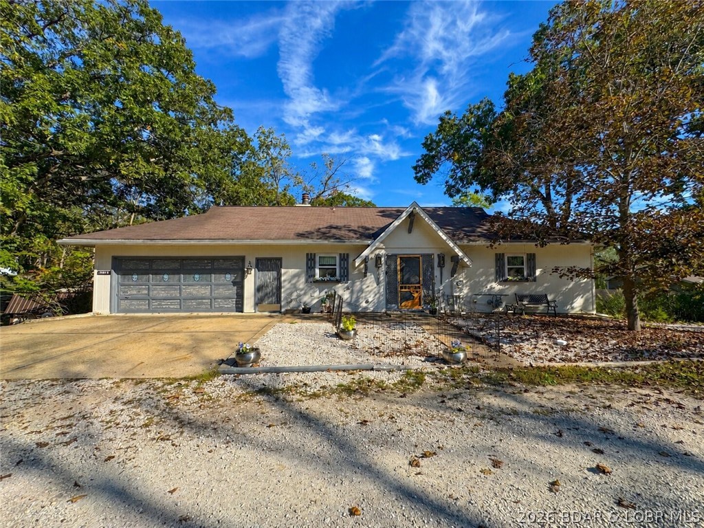 Priced below recent appraisal! Located down the highly desirable “O” Road in Laurie, this updated home combines quality construction with modern upgrades. The main level features 1-level living with a new kitchen with hickory cabinets, gas stove, double oven, and stainless countertops, plus new baths, sliders, and decks. You’ll also find the main bedroom suite, laundry, and a half bath on the main level. The lower level offers a spacious walkout family room, 3 bedrooms, a full bath, and a bonus room for hobbies, storage, or extra sleeping space. This home even has a central vacuum.  There is an oversized two-stall garage with workbenches. The second parcel provides space for a camper or to add a shop or pool. There is a nice shed on it now. Your boat slip in the community dock is just a short golf cart ride away— the golf cart is included. So is the boat and the lift. Seller offering a 1-year home warranty. Peaceful neighborhood setting close to golf, movie theater, and some of the best restaurants at the lake! Seller motivated - come take a look!