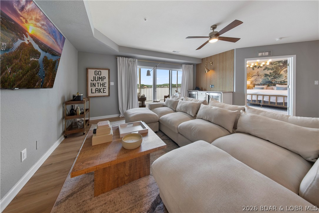 Experience effortless lake living in this completely updated top-floor condo at Seascape Point in the heart of Osage Beach. Offered fully furnished with stunning high-end furnishings and custom finishes throughout, this turnkey property is truly move-in ready. The spacious open-concept floor plan features 3 bedrooms, a walk-in pantry, expansive bar-top seating, and a stylish wine cooler/bar area designed for entertaining. The beautifully updated interior includes a luxurious walk-in shower and thoughtful upgrades at every turn. Step onto the expansive covered deck and enjoy breathtaking views of the 20MM while relaxing in a peaceful setting. Conveniently located next to the elevator, this top-floor unit offers easy access without sacrificing privacy. Two boat slips on the community dock are included, making it easy to enjoy everything Lake of the Ozarks has to offer. Nestled in a quiet neighborhood, yet just minutes from popular waterfront destinations including Kelly's Port, Shorty Pants, Redhead, High Tide, and Dog Days. Combining luxury, convenience, and low-maintenance living, this exceptional lakefront retreat offers the perfect blend of comfort and lifestyle.