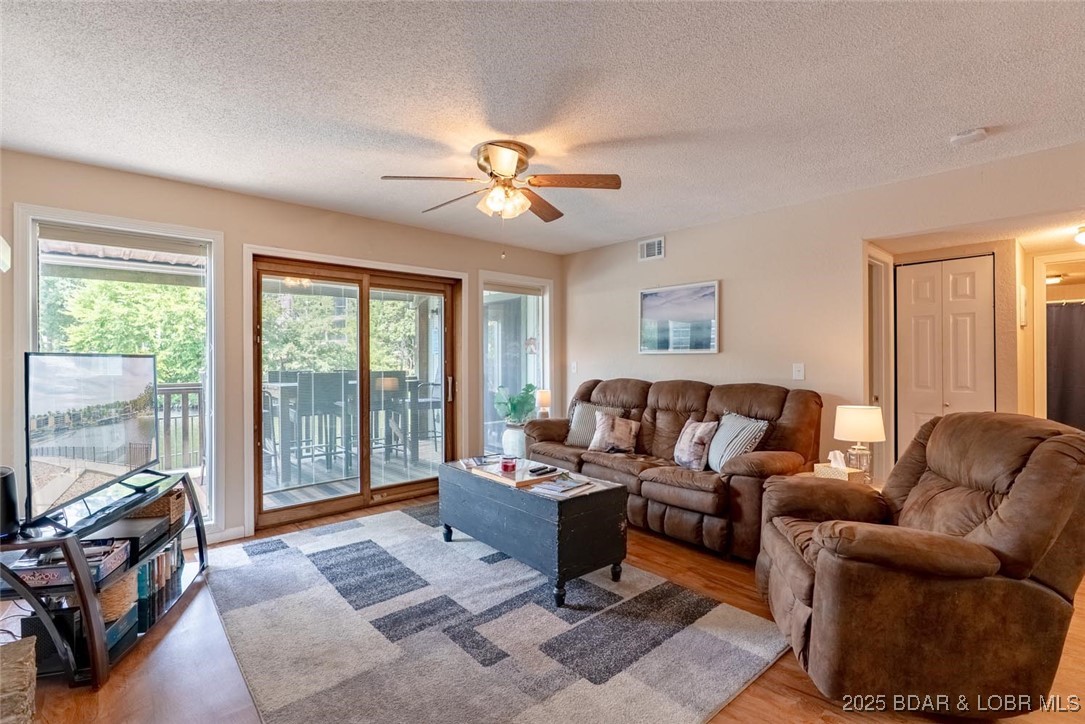 More lake time, less expense - seller will pay SIX MONTHS of assessments with acceptable contract.  Beautifully updated 2 bed, 2 bath condo in a peaceful lakeside community—just steps from the water! This renovated unit features a modern kitchen with sleek countertops, stylish backsplash, and plenty of cabinet space. The open-concept layout flows into a bright living area, perfect for relaxing or entertaining. Enjoy stunning lake views from the master suite with floor-to-ceiling windows and private balcony access. The second bedroom is ideal for guests, a home office, or hobby room. Step onto the spacious balcony to take in the breathtaking lake views. Community amenities include indoor/outdoor pools, hot tubs, boat ramp, playground, tennis & basketball courts, fish cleaning station, 10X24 Boat Slip and more. Spend your days swimming, fishing, or simply enjoying the view from your own back deck. Ideal as a weekend retreat, full-time home, or rental property—this is lake living at its best!