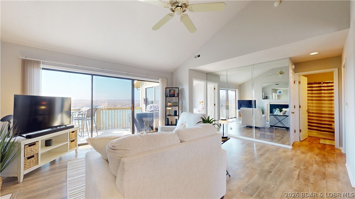 LAKE OF THE OZARKS - Panoramic Main Channel Views – Top-Floor End Unit - Start your mornings overlooking the water in this turn-key 2-bedroom, 2-bath condo with breathtaking main channel views. Located in a top-floor end unit, the home features vaulted ceilings and abundant natural light, creating a bright and spacious feel. Both the living room and primary suite open to the private deck, offering the perfect spot to enjoy lake breezes and sweeping views. The kitchen includes granite countertops with bar seating, ideal for casual dining or entertaining. Community amenities include two pools—including a lakefront pool with clubhouse—plus a playground and green space for pets. The complex also offers the rare convenience of free boat trailer parking. Recent updates include a newer HVAC system. Perfect for full-time living, a weekend retreat, or rental income, with easy access to nearby restaurants, shopping, and lake attractions.