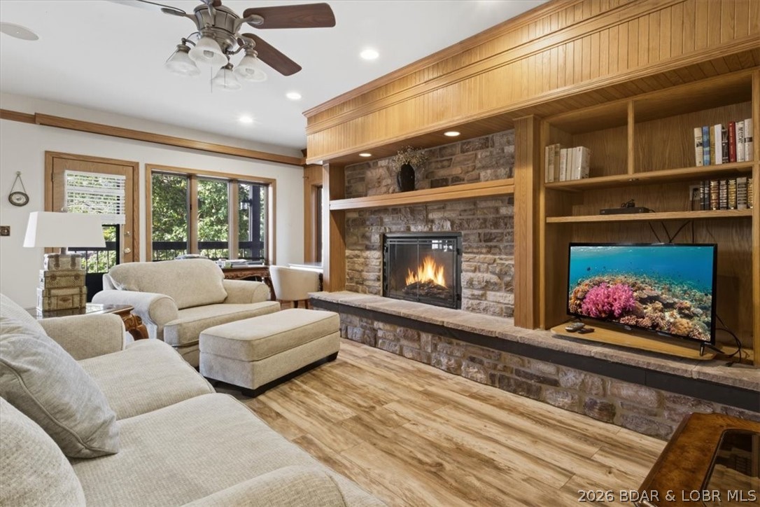 MOTIVATED SELLER! Discover lakefront living at its finest with this beautiful 2 bedroom (w/ bonus room that could be used as 3rd bedroom or office), 2 bath condo located in the highly sought-after Knolls Resort Condos. This end unit offers extra privacy & views of the 21 MM in Red Head's Cove. Thoughtfully updated throughout, the condo features a warm & inviting living area with a fireplace & stunning built-in shelving that adds character. Partially furnished, this condo is ready for your personal touch! A 10x30 boat slip and hoist is included, giving you convenient access to the lake. Hop in your boat & head to some of the lake’s most popular restaurants such as Redhead Lakeside Grill, Shorty Pants, Paradise, Backwater Jacks & Dog Days Bar & Grill, all just a short ride away. The Knolls is known for its extensive list of community amenities such as both indoor & outdoor swimming pools, tennis courts, a fitness center & plenty of gathering spaces for family & friends. This condo makes the perfect full-time residence, vacation home or short-term rental. Schedule your showing today!