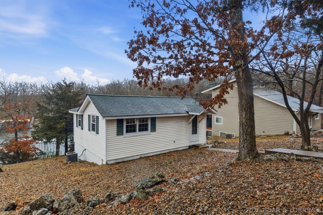 Discover this unique 2-bedroom, 1-bath lakefront cabin offering 480 sq. ft. of cozy charm at the Lake of the Ozarks. Perfect as a fisherman's retreat, weekend getaway, or vacation escape, this waterfront property is full of potential and ready for your personal touch. Enjoy peaceful lake living with beautiful water views and endless opportunities to make it your own. The property is being sold AS IS. A lift is included with the sale; the seller has no information regarding the lift. Don't miss your chance to own an affordable lakefront getaway!