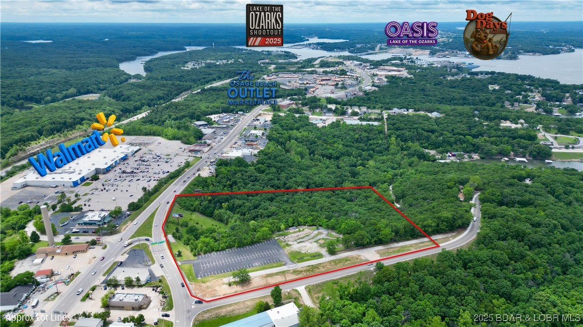PRICED TO MOVE!! Unmatched opportunity in the heart of Osage Beach! This 13-acre lot sits on one of the busiest, most high-traffic corners in town—offering exceptional highway frontage, year-round visibility, and direct access to the Lake of the Ozarks. Perfectly positioned near major box stores, restaurants, and top lake attractions, this property is a dream for investors or developers ready to make a bold move. With its expansive layout, stunning lake views, and proximity to Osage Beach Parkway and US-54, the possibilities are endless—think retail, dining, entertainment, resort, or mixed-use. Rarely does land of this size and strategic placement become available in such a hot corridor. Whether you're looking to break ground on the next big destination or hold a prime piece of Osage Beach real estate, this is the opportunity you've been waiting for. Utilities nearby. Bring your vision—this property is ready for something BIG!