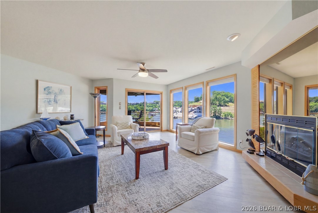 Lake life doesn't get much easier than this. Located at the 3MM, this fully furnished 2 bed, 2 bath condo offers convenient single-level living with no stairs & amazing views. The thoughtfully updated interior features durable COREtec luxury vinyl plank flooring, expansive windows showcasing the water from the main living area, & a stylish kitchen complete with custom cabinetry, quartz countertops, stainless steel appliances, & a built-in beverage cooler. The oversized covered deck extends your living space outdoors, creating the perfect place to enjoy morning coffee & entertain guests. Includes a 12x32 boat slip, 6,000lb hoist and PWC slip tucked away in a protected no-wake cove. The Breakers is a sought after complex with resort-style amenities including a lakeside swimming pool, clubhouse, & tennis/pickleball court. Just minutes from some of the Lake's favorite waterfront restaurants, shopping, golf, & entertainment. Ideal for full-time living or weekend escapes. Bonus- complex is getting new decks next year & seller is paying for it, so no worries for you getting any special assessments. It’s a win-win for you, making this move-in-ready condo an exceptional value.