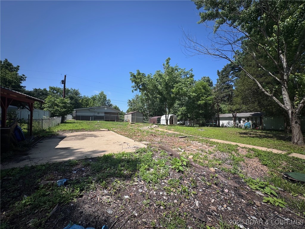 Sunny Slope Subdivision Lake Access Lot ......Ready to Build in the Perfect Location! This generously sized lot comes equipped with community water and sewer district, saving you time, hassle, and money from day one. Nestled in a well-established subdivision just minutes from the lake, this prime parcel offers lake access with a nearby boat ramp within walking distance—a rare find! You’ll also love the close proximity to shopping, dining, and all the essentials. Whether you're planning your dream home or looking for a savvy investment, this lot checks all the boxes. Owner financing available—don’t miss this incredible opportunity!