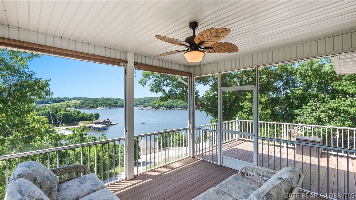 Tucked away on a quiet cul-de-sac at the 2 Mile Marker of the Niangua Arm, Great Escapes lives up to its name the moment you arrive. This thoughtfully designed home sits in a second-tier setting, giving you extra breathing room, added privacy, and a sense of space that's hard to come by at the lake. Step inside to an airy, open-concept main level where the kitchen, dining, and living areas flow together under panoramic lake views that stop you in your tracks. The kitchen is built for everyday cooking with granite countertops and a full suite of stainless steel appliances. Outdoor living is what this home is all about. A screened deck lets you soak in the lake breeze without the bugs, while the adjoining open deck is made for morning coffee and sunset cocktails alike. Down below, the large walk-out patio extends your entertaining space and leads to a bonus room ideal as a game room or bunk room. When it's time to hit the water, your 12' × 34' boat slip at the community dock puts the entire lake at your fingertips. Back on land, the attached two-car garage keeps the toys secure and out of the elements. Live the dream now at an affordable price!