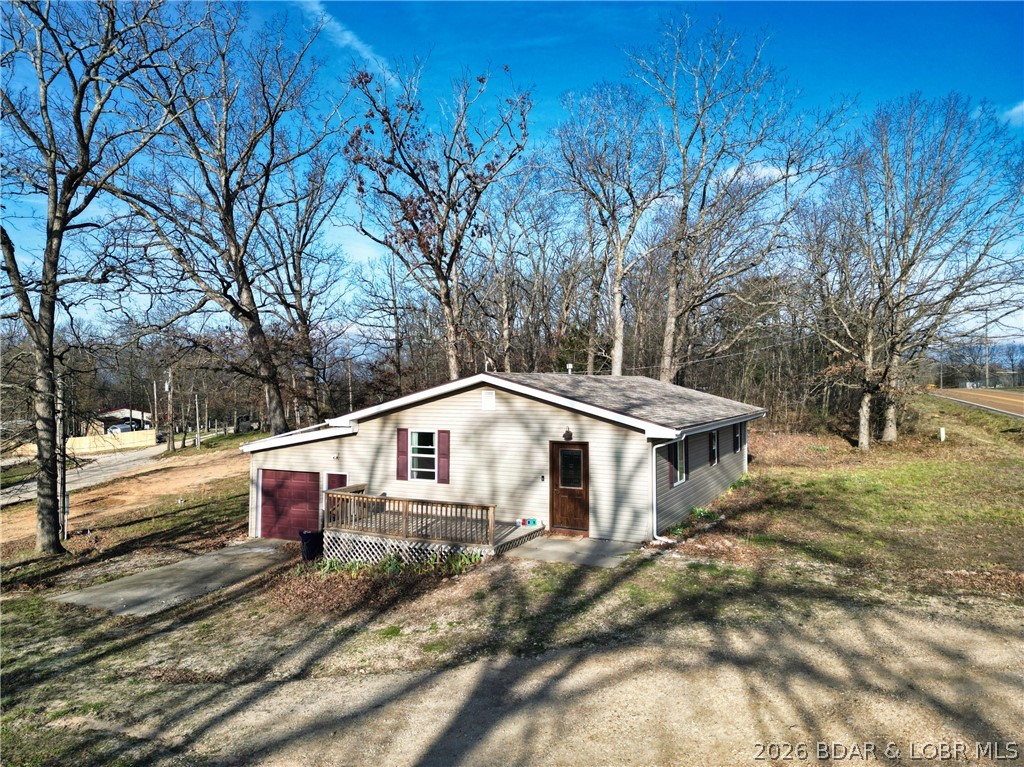Welcome to this beautifully renovated, move-in-ready home located at 447 Hwy W in Eldon! This charming 3-bedroom, 1-bath property has been completely redone from top to bottom, offering the perfect blend of modern updates and cozy comfort.

Step inside to a stunning kitchen featuring butcher block countertops, a stylish tile backsplash, and a clean, modern feel that's perfect for everyday living or entertaining. The home also includes all new wiring and updated plumbing, giving you peace of mind for years to come.

Enjoy the convenience of a 1-car garage and a solid, well-built structure that truly stands out as a turnkey opportunity. Whether you're a first-time home buyer or looking to downsize into something low-maintenance, this home checks all the boxes.

Ideally located just 15 minutes from Lake of the Ozarks and 15 minutes from Eldon, you'll have quick access to recreation, shopping, and dining while still enjoying a more relaxed setting.

Don't miss your chance to own a fully updated home at an affordable price point--schedule your showing today!