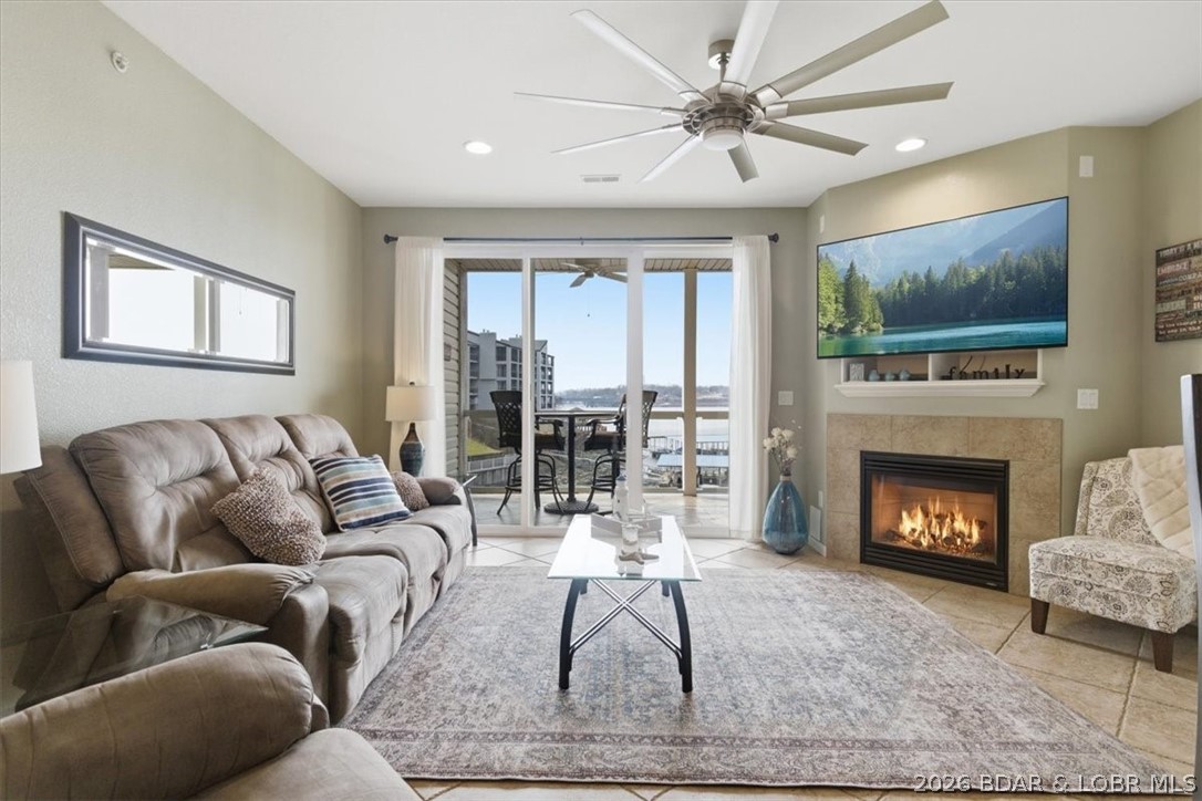 Location - Location - Location - and the largest boat slip available at Lands' End. 16' x 48' boat slip is included with this Updated Condo that has Quartz Countertops, Stainless Steel Appliances, gorgeous glazed maple cabinetry with crown molding, 9-foot interior ceilings, a gas fireplace and waterfront views. Primary bedroom has deck access and an En Suite with a double bowl vanity, a walk-in closet and a walk-in shower. Turnkey condo includes all of the furniture, as well as a main floor laundry with a washer/dryer and water softener. Large ceramic tiled deck overlooks the new Oasis at Lakeport Theme Park with Ferris Wheel opening in 2027, Dog Days, and to the right is the main channel at the 19 MM. There is a storage closet and a sprinkler system on the deck so you can enjoy the newer BBQ pit. This well-cared for condo has been owner occupied and not rented, but rentals are allowed, and the location is superb! Lands End offers a lazy river, a splash pad pool & the main pool, an exercise facility and clubhouse with pool table, playground and basketball. This is the perfect LOTO location near all of the hot spots by land or by lake in Osage Beach.  No Step Entry via the Elevator.